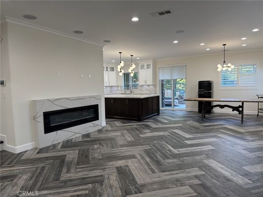 Chandelier, Fireplace, Game Room, Interior, Pendant Lights, Recessed Lighting, Wood Texture Flooring
