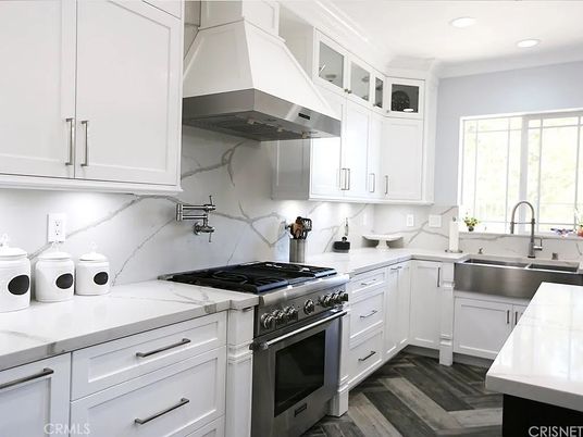Interior, Kitchen, Marble Walls, Recessed Lighting, Stainless Steel Appliances, Wood Texture Flooring