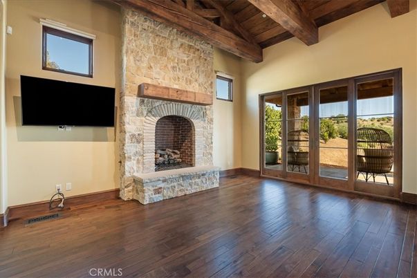 Empty room, Fireplace, Interior, Stone Walls, Wooden Beams, Wood Texture Flooring