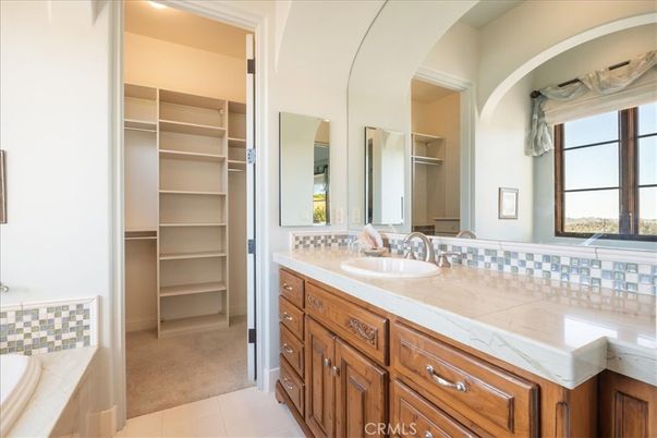Bathroom, Dual Sink Vanities, Interior, Recessed Lighting, Tile Countertops, Walk-in Closets