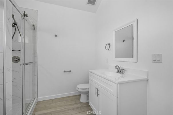 Bathroom, Glass Shower, Interior, Marble Walls, Wood Texture Flooring