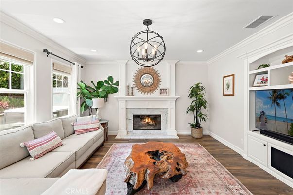 Chandelier, Fireplace, Interior, Living room, Recessed Lighting, Wood Texture Flooring