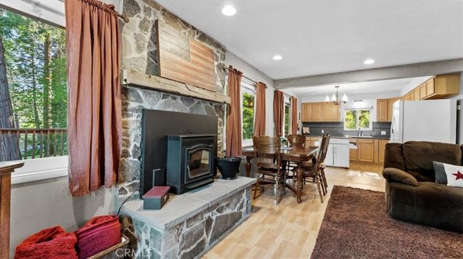 Chandelier, Dining room, Fireplace, Interior, Kitchen, Living room, Recessed Lighting, Stone Walls, Wood Texture Flooring