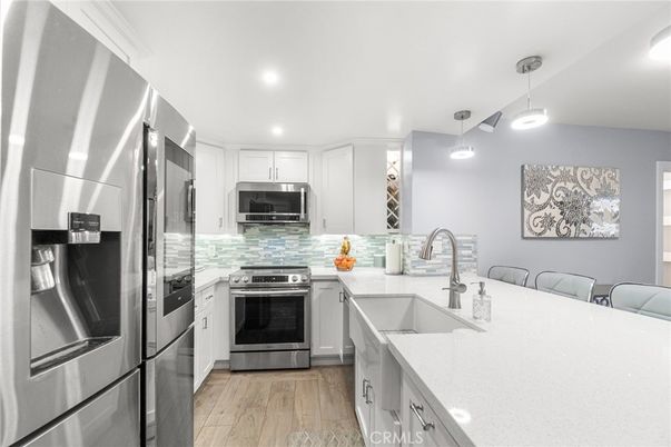 Interior, Kitchen, Pendant Lights, Recessed Lighting, Stainless Steel Appliances, Wood Texture Flooring
