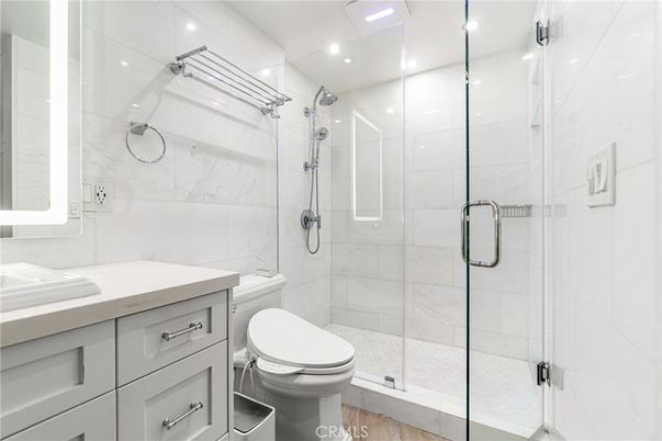 Bathroom, Glass Shower, Interior, Marble Walls, Recessed Lighting, Wood Texture Flooring