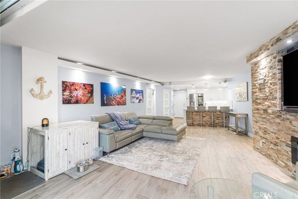 Fireplace, Interior, Kitchen, Living room, Recessed Lighting, Stone Walls, Wood Texture Flooring