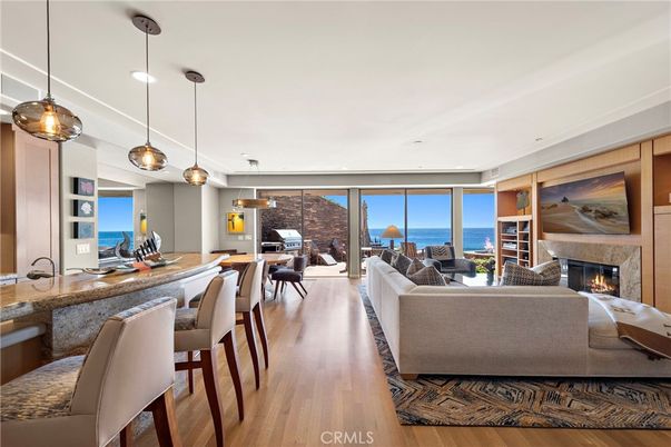 Dining room, Fireplace, Interior, Living room, Pendant Lights, Recessed Lighting, Water, Wood Texture Flooring