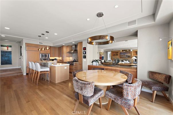 Dining room, Interior, Kitchen, Pendant Lights, Recessed Lighting, Stainless Steel Appliances, Wood Texture Flooring