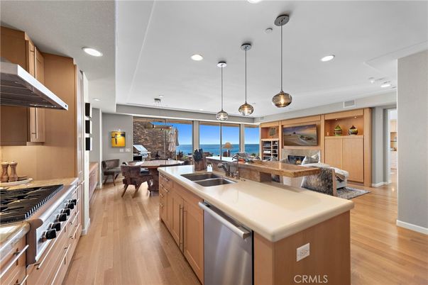 Dining room, Interior, Kitchen, Pendant Lights, Recessed Lighting, Stainless Steel Appliances, Water, Wood Texture Flooring