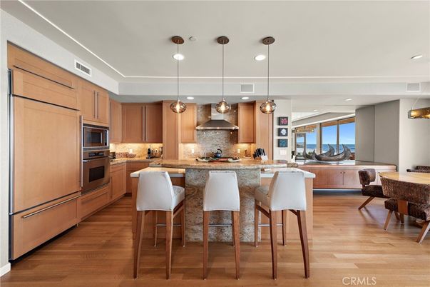 Dining room, Interior, Kitchen, Pendant Lights, Recessed Lighting, Stainless Steel Appliances, Water, Wood Texture Flooring