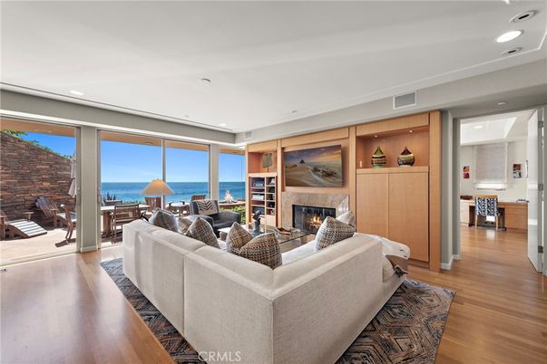 Fireplace, Interior, Living room, Recessed Lighting, Stone Walls, Water, Wood Texture Flooring