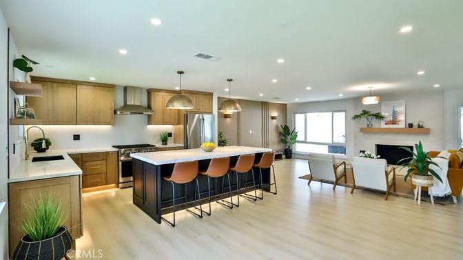 Dining room, Fireplace, Interior, Kitchen, Pendant Lights, Recessed Lighting, Stainless Steel Appliances, Wood Texture Flooring