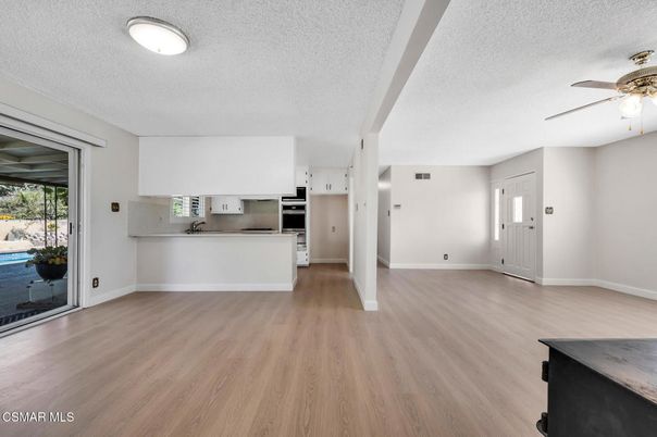 Empty room, Interior, Kitchen, Stainless Steel Appliances, Wood Texture Flooring