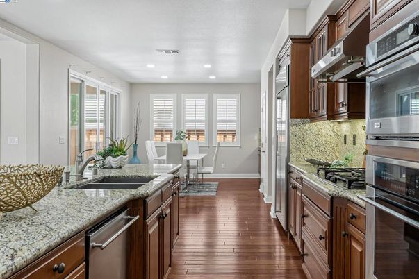 Dining room, Interior, Kitchen, Recessed Lighting, Stainless Steel Appliances, Wood Texture Flooring