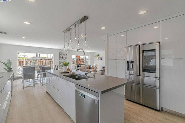 Dining room, Interior, Kitchen, Pendant Lights, Recessed Lighting, Stainless Steel Appliances, Wood Texture Flooring