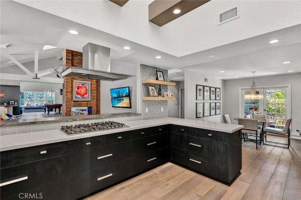 Dining room, Interior, Kitchen, Pendant Lights, Recessed Lighting, Stainless Steel Appliances, Wood Texture Flooring