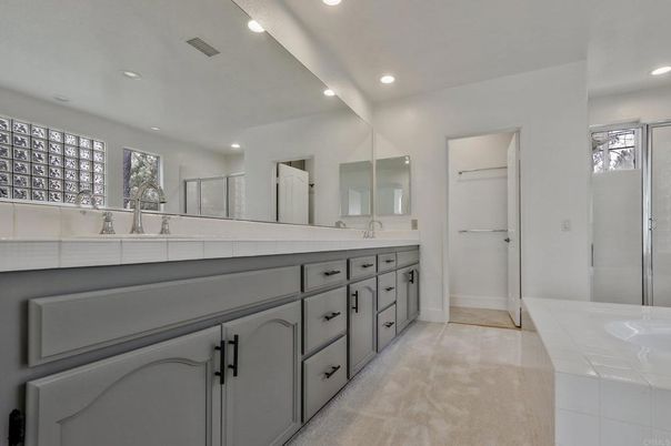 Bathroom, Dual Sink Vanities, Interior, Recessed Lighting, Tile Countertops
