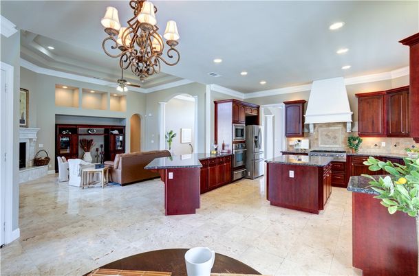 Chandelier, Fireplace, Interior, Kitchen, Living room, Recessed Lighting, Stainless Steel Appliances