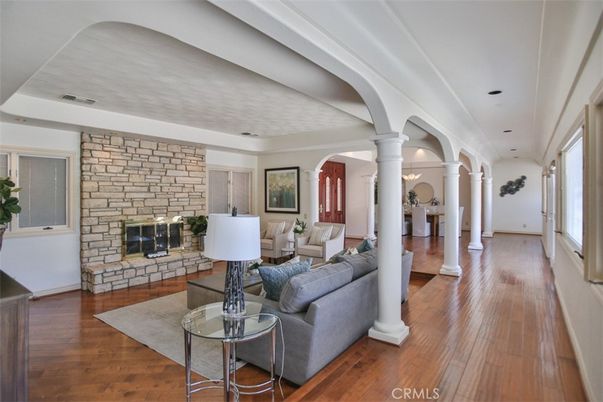 Fireplace, Interior, Living room, Recessed Lighting, Stone Walls, Wood Texture Flooring