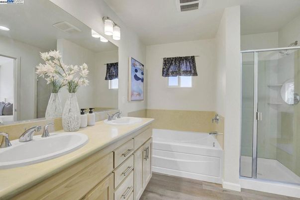 Bathroom, Dual Sink Vanities, Glass Shower, Interior, Recessed Lighting, Wood Texture Flooring