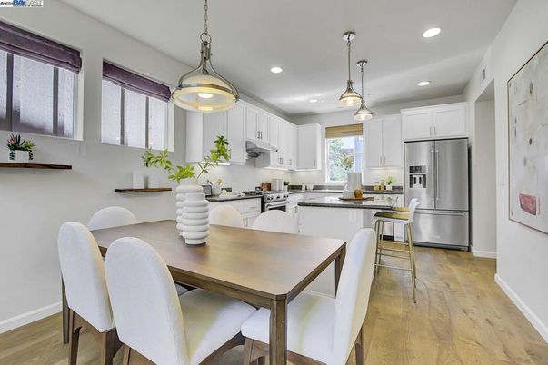 Dining room, Interior, Kitchen, Pendant Lights, Recessed Lighting, Stainless Steel Appliances, Wood Texture Flooring