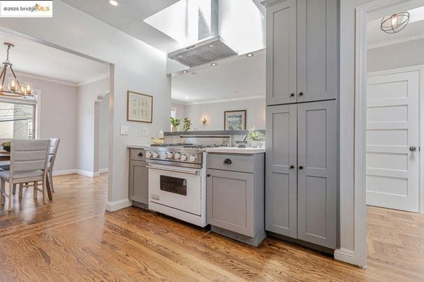 Chandelier, Dining room, Interior, Kitchen, Recessed Lighting, Stainless Steel Appliances, Wood Texture Flooring