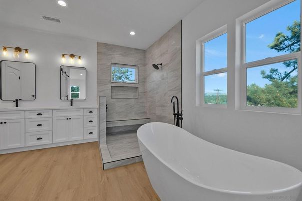 Bathroom, Dual Sink Vanities, Free Standing Baths, Interior, Marble Walls, Recessed Lighting, Wood Texture Flooring