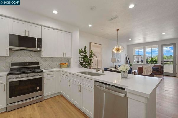 Dining room, Interior, Kitchen, Living room, Pendant Lights, Recessed Lighting, Stainless Steel Appliances, Wood Texture Flooring