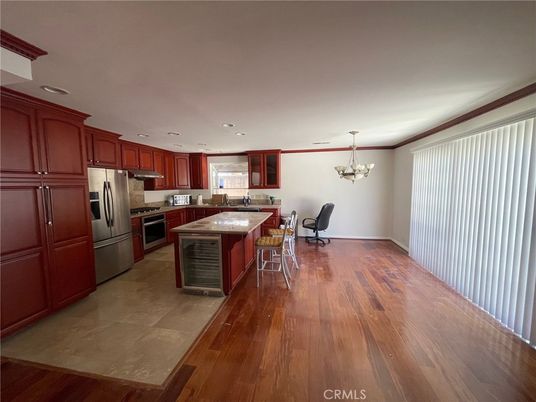 Chandelier, Dining room, Interior, Kitchen, Recessed Lighting, Stainless Steel Appliances, Wood Texture Flooring