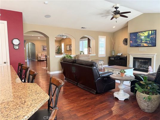 Dining room, Fireplace, Interior, Living room, Recessed Lighting, Wood Texture Flooring
