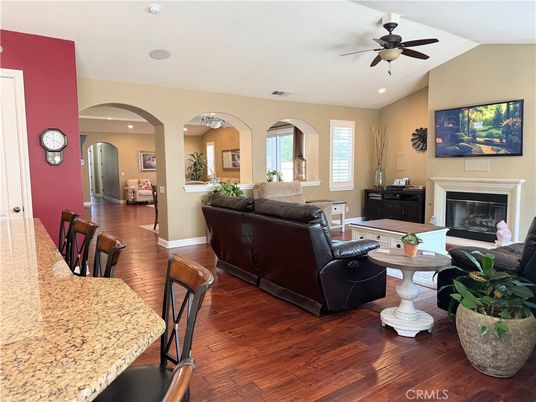 Dining room, Fireplace, Interior, Living room, Recessed Lighting, Wood Texture Flooring