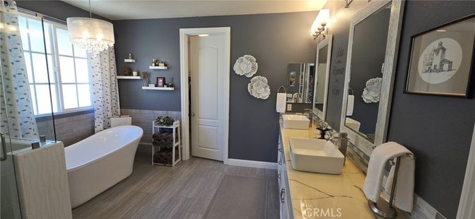 Bathroom, Chandelier, Dual Sink Vanities, Free Standing Baths, Interior, Wood Texture Flooring