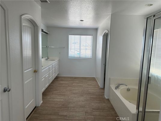 Bathroom, Dual Sink Vanities, Interior, Recessed Lighting, Wood Texture Flooring