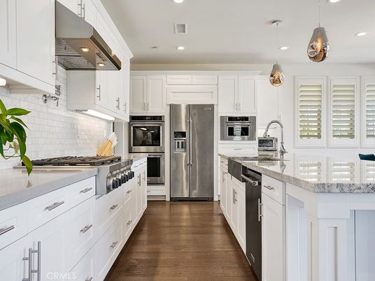 Dining room, Interior, Kitchen, Pendant Lights, Recessed Lighting, Stainless Steel Appliances, Wood Texture Flooring