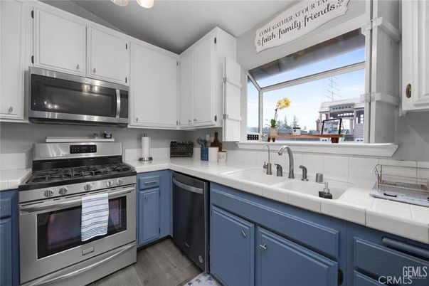 Interior, Kitchen, Stainless Steel Appliances, Tile Countertops, Wood Texture Flooring