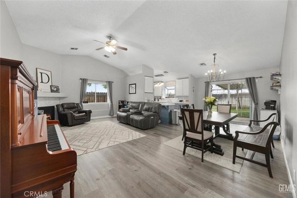 Chandelier, Dining room, Fireplace, Interior, Kitchen, Living room, Pendant Lights, Piano, Wood Texture Flooring