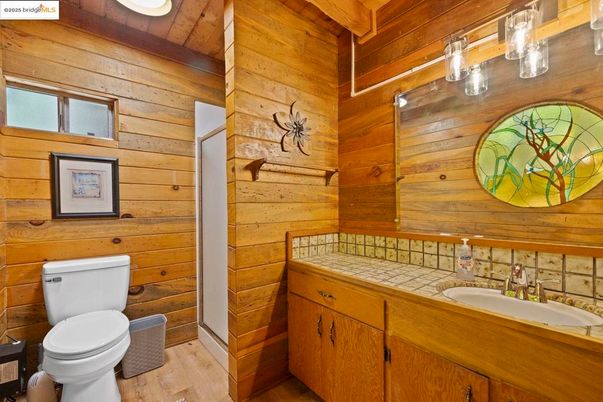 Bathroom, Interior, Tile Countertops, Wood Texture Flooring, Wooden Walls