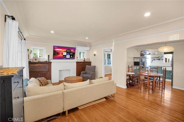 Dining room, Fireplace, Interior, Living room, Pendant Lights, Recessed Lighting, Wood Texture Flooring