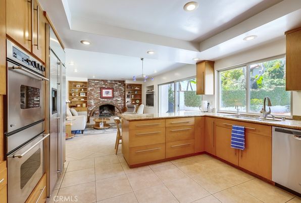 Fireplace, Interior, Kitchen, Living room, Recessed Lighting, Stainless Steel Appliances, Stone Walls
