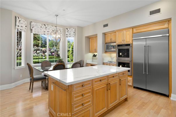 Chandelier, Dining room, Interior, Kitchen, Pendant Lights, Stainless Steel Appliances, Wood Texture Flooring