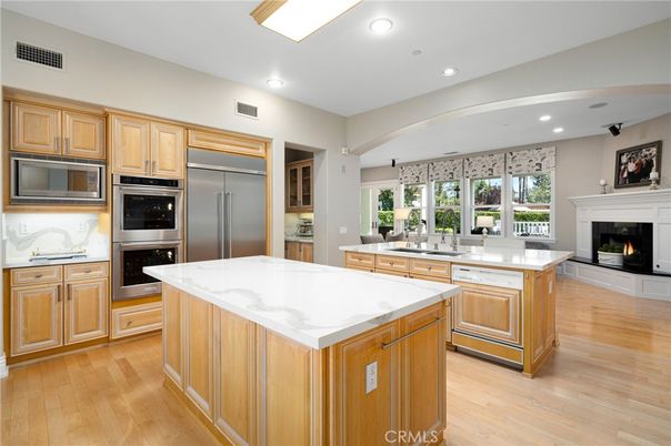 Fireplace, Interior, Kitchen, Recessed Lighting, Stainless Steel Appliances, Wood Texture Flooring