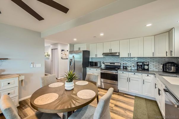 Dining room, Interior, Kitchen, Recessed Lighting, Stainless Steel Appliances, Wood Texture Flooring