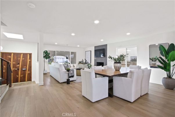 Dining room, Fireplace, Interior, Living room, Recessed Lighting, Wood Texture Flooring