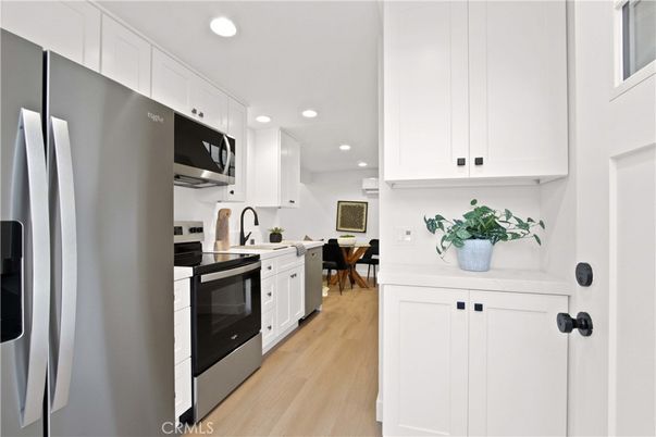 Dining room, Interior, Kitchen, Recessed Lighting, Stainless Steel Appliances, Wood Texture Flooring