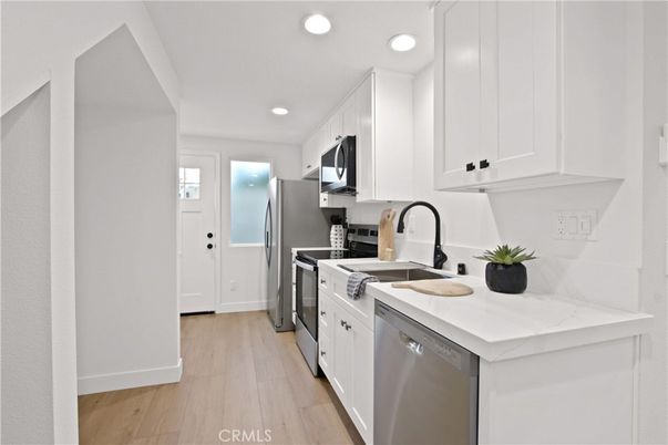 Interior, Kitchen, Recessed Lighting, Stainless Steel Appliances, Wood Texture Flooring