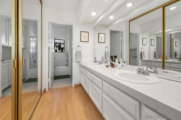 Bathroom, Dual Sink Vanities, Interior, Recessed Lighting, Tile Countertops, Wood Texture Flooring
