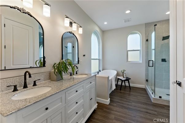 Bathroom, Dual Sink Vanities, Glass Shower, Interior, Recessed Lighting, Wood Texture Flooring