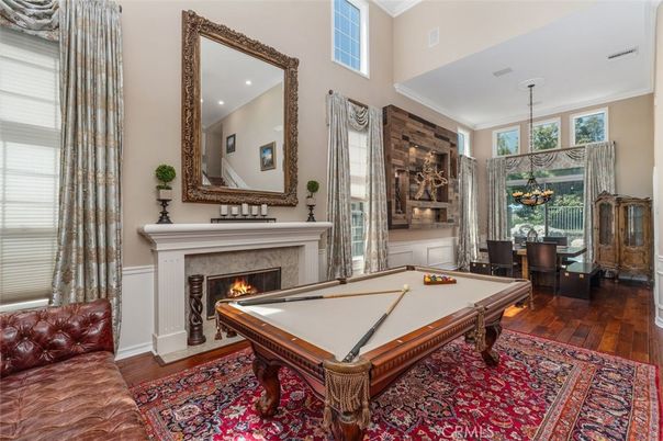 Billiard Table, Chandelier, Fireplace, Game Room, Interior, Pendant Lights, Recessed Lighting, Wood Texture Flooring