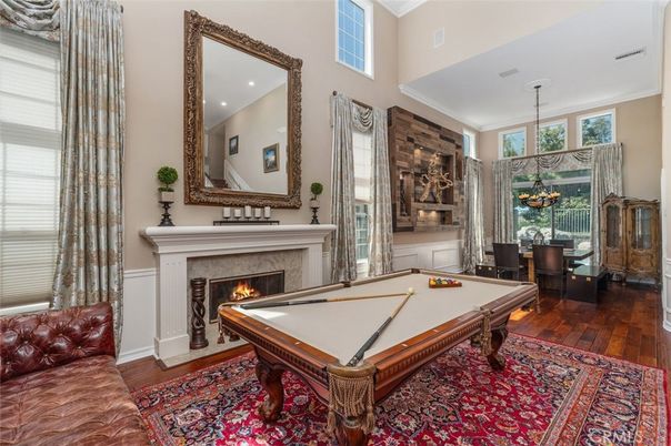 Billiard Table, Chandelier, Fireplace, Game Room, Interior, Pendant Lights, Recessed Lighting, Wood Texture Flooring