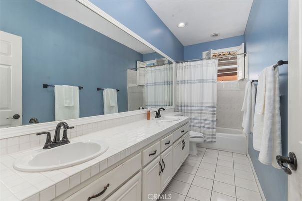 Bathroom, Dual Sink Vanities, Interior, Recessed Lighting, Tile Countertops
